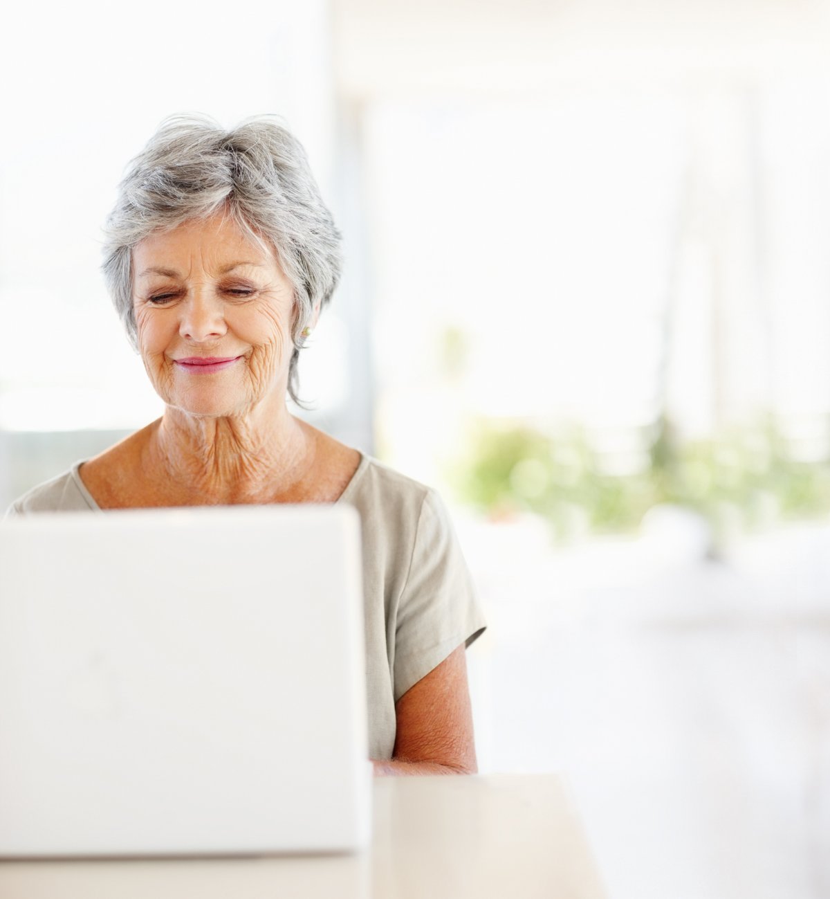 A Medicare member at her laptop