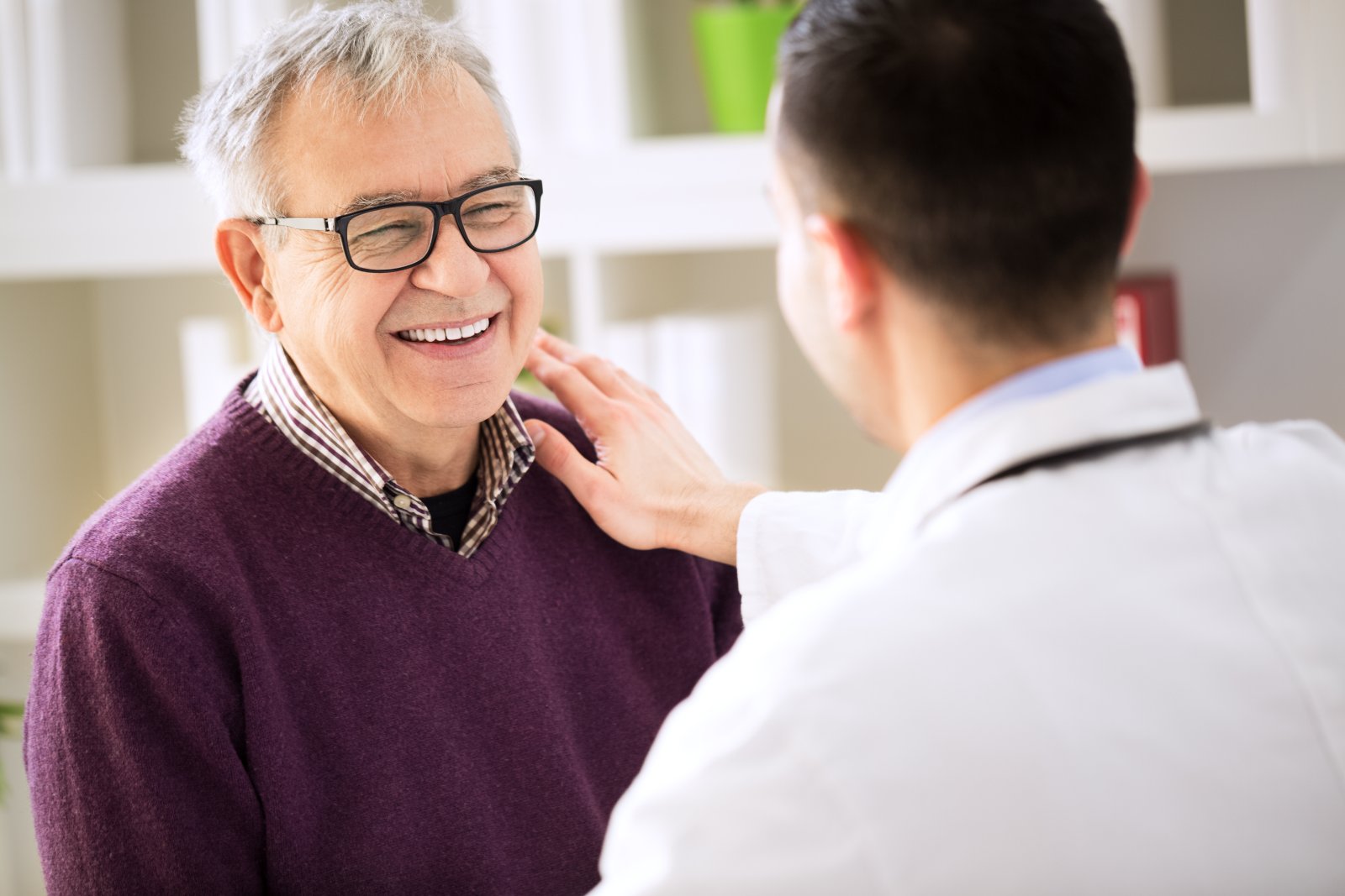 A physician talking with an older patient